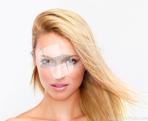 Image of Portrait, skincare and hair of a woman closeup in studio on a white background for natural wellness or cosmetics. Face, beauty and foundation with a confident young model at the salon for dermatology