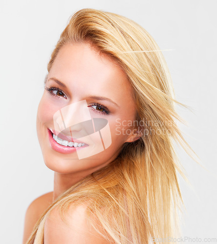 Image of Happy woman, portrait and face in skincare beauty, makeup or cosmetics against a studio background. Female person, blonde or model smile for spa salon or facial treatment in relax or skin dermatology