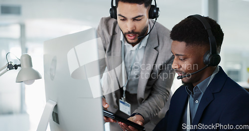 Image of Call center, training and man learning in office with mentor, technical support and advice for working on computer. Employees, collaboration and questions for manager helping on project with tech