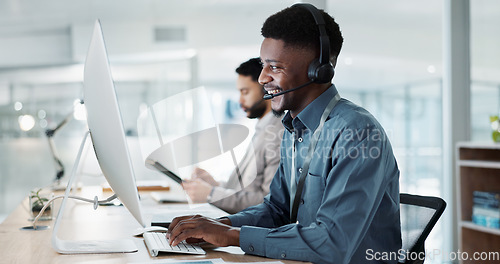 Image of Happy black man, call center and customer service in telemarketing, communication or support at office. African male person or consultant agent smile in online advice, help or contact us at workplace