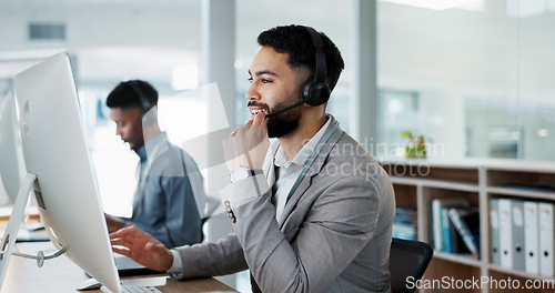 Image of Call center, customer service and man on an online consultation on a computer working in the office. Contact us, crm and young male telemarketing consultant or agent talking for support in workplace.