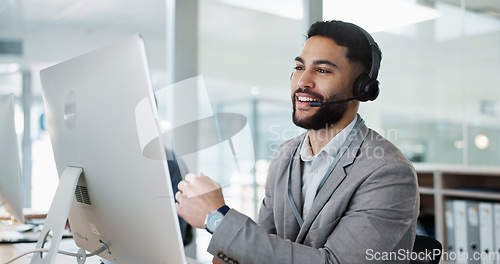 Image of Call center, customer service and man on an online consultation on a computer working in the office. Contact us, crm and young male telemarketing consultant or agent talking for support in workplace.