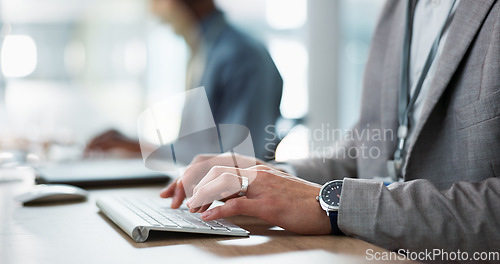 Image of Keyboard, hands and businessman in the office typing for creative project research on a computer. Technology, career and professional male designer working on website or internet in modern workplace.