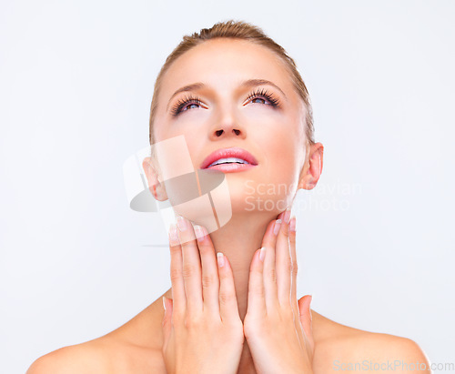 Image of Face, thinking and beauty of a woman closeup in studio on a white background for natural wellness or cosmetics. Vision, hands and skincare with a confident young model at the salon for dermatology