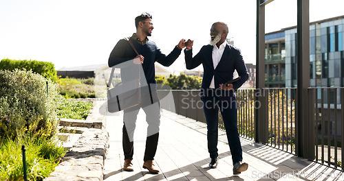 Image of Business people, outdoor and men with fist bump, partnership and agreement with b2b deal. Staff, support and employees outside, hand gesture and thank you with cooperation, teamwork and collaboration