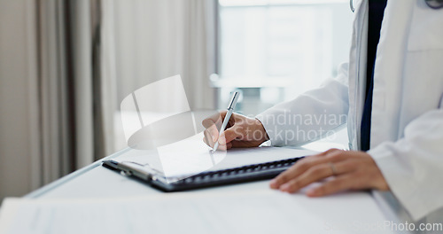 Image of Doctor, hands and writing on checklist at desk for health, information and paperwork. Table, clipboard and closeup of medical woman on chart for prescription, notes or insurance document in hospital