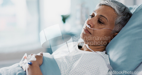 Image of Sick, iv drip and senior woman in the hospital for consultation, surgery or treatment. Healthcare, recovery and elderly female patient resting in bed after operation or procedure in a medical clinic.