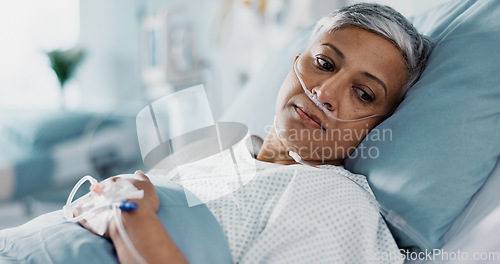 Image of Medical, iv drip and senior woman in the hospital for consultation, surgery or treatment. Healthcare, recovery and elderly female patient resting in bed after operation or procedure in a clinic.