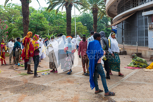 Image of Celebrating Easter in Bahir Dar, Ethiopia. Men and women fill the streets, with women adorned in white scarves, reflecting the cultural traditions and festive atmosphere of the occasion.