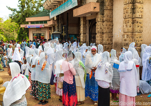 Image of Celebrating Easter in Bahir Dar, Ethiopia. Men and women fill the streets, with women adorned in white scarves, reflecting the cultural traditions and festive atmosphere of the occasion.