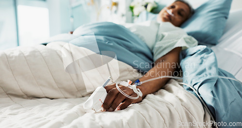 Image of Healthcare, iv drip and senior woman in the hospital for consultation, surgery or treatment. Medical, recovery and elderly female patient resting in bed after operation or procedure in a clinic.