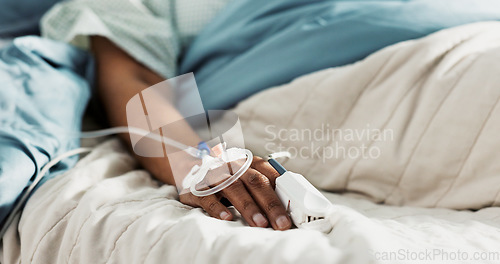 Image of Iv drip, emergency and hand of patient in a hospital after surgery, treatment and operation in a clinic sleeping. Closeup, healthcare and person in medical ER for recovery, life support and medicine