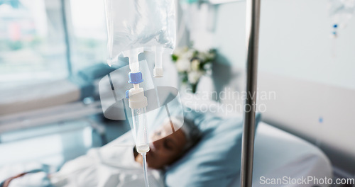 Image of Hospital, IV drip and woman in a clinic bed for surgery or wellness emergency with closeup of liquid. Medical, healthcare and senior female patient with fluid for nutrition and infusion for health
