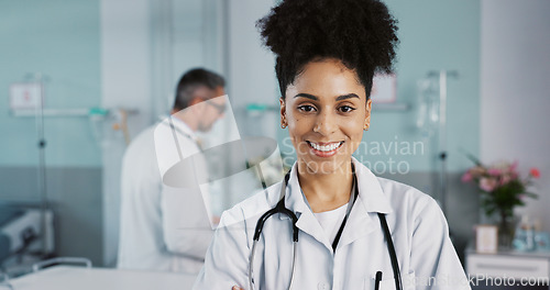 Image of Hospital, doctor and face of woman with crossed arms for medical service, care and insurance. Healthcare, professional and portrait of person smile for consulting, medicine and medicare in clinic