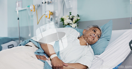Image of Healthcare, sick and senior woman in the hospital for consultation, surgery or treatment. Medical, recovery and elderly female patient resting in bed on iv drip after operation or procedure in clinic
