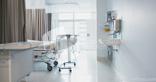 Image of Hospital, modern and interior of bedroom or empty room for healthcare, consulting or healing. Background, medical and clinic space for emergency, rehabilitation or recovery with furniture or light