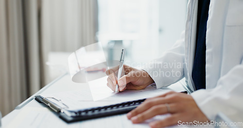 Image of Doctor, hands and writing on checklist at desk for health, information and paperwork. Table, clipboard and closeup of medical woman on chart for prescription, notes or insurance document in hospital