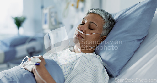 Image of Sick, iv drip and senior woman in the hospital for consultation, surgery or treatment. Healthcare, recovery and elderly female patient resting in bed after operation or procedure in a medical clinic.