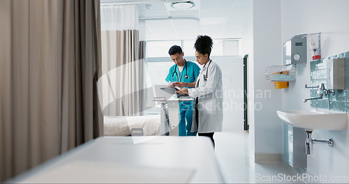 Image of Doctor, team and nurse in discussion on tablet, planning and communication in hospital with bag. Technology, medical professional workers and people research healthcare online, wellness or telehealth