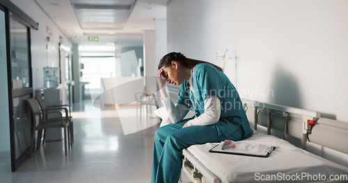 Image of Stress, sad and loss with a woman nurse in hospital after a fail, mistake or error in healthcare treatment. Depression, anxiety and grief with a young medicine professional in a medical clinic