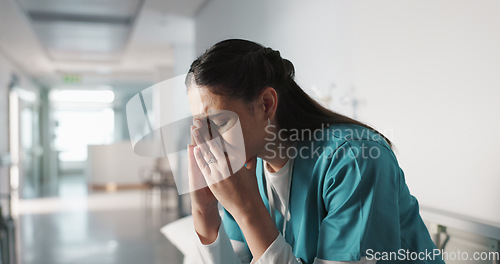 Image of Stress, sad and loss with a woman nurse in hospital after a fail, mistake or error in healthcare treatment. Depression, anxiety and grief with a young medicine professional in a medical clinic