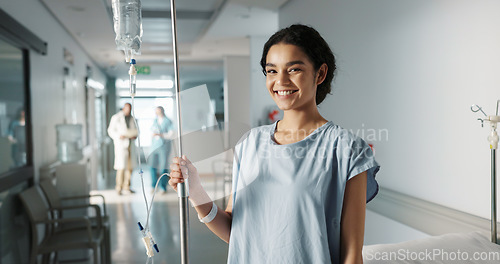 Image of Iv drip, patient and portrait of happy woman in a hospital or clinic corridor with treatment for recovery from surgery. Intravenous, medicine and person with medical insurance for care and health