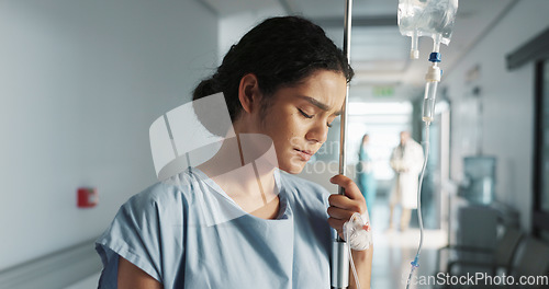 Image of Sad, breathing and a woman with an iv drip at hospital for medicine, wellness and recovery from virus. Depression, thinking and a clinic patient with treatment stress, burnout or anxiety while sick