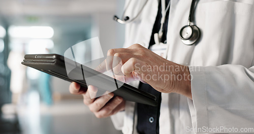 Image of Doctor, hands and tablet for healthcare or medical information, online charts and research results in clinic. Health worker or person with x ray analysis on digital technology or hospital software