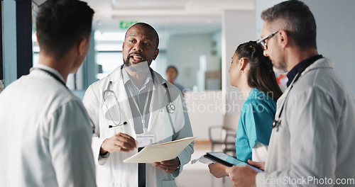 Image of Doctors, nurses and team or hospital management with workflow, schedule planning and speaking of services. Healthcare worker, mentor and people with medical documents, clinic files and internship