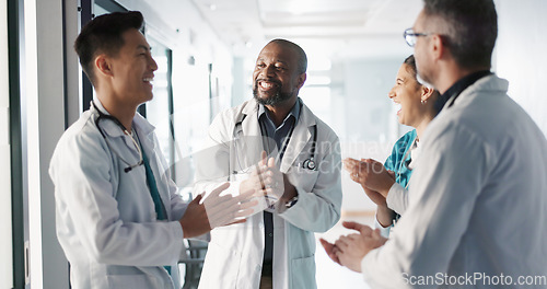 Image of Doctors, nurses and hands together, applause and support, success or collaboration for hospital goals and teamwork. Medical or healthcare people clapping and stack for clinic mission and celebration