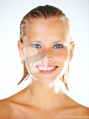 Image of Shower, happy and portrait of woman on a white background for wellness, grooming and beauty. Water, luxury spa and face of isolated person with wet hair for skincare, washing and cleaning in studio