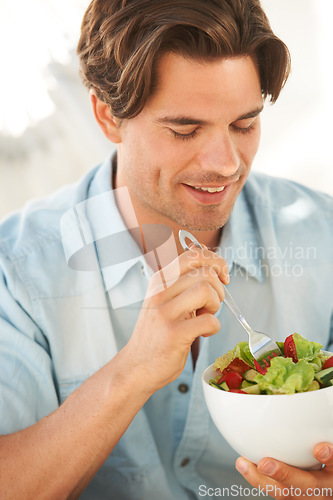 Image of Man, salad and healthy food, diet and lunch with wellness, eating meal with smile and nutrition. Health, dinner and bowl in hands with lettuce and vegetables to lose weight, hungry and self care