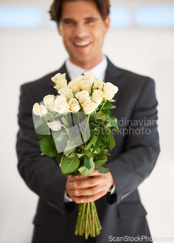 Image of Gift, portrait and happy man with flowers for love, giving or valentines day celebration on wall background. Face, roses and person with bouquet for anniversary, romance or congratulations gesture