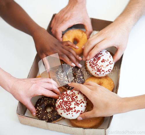 Image of Donut, box and hands of people with delivery of food in office, meeting or white background in studio. Hungry, group and employees eating doughnuts for snack break in company and workplace mockup