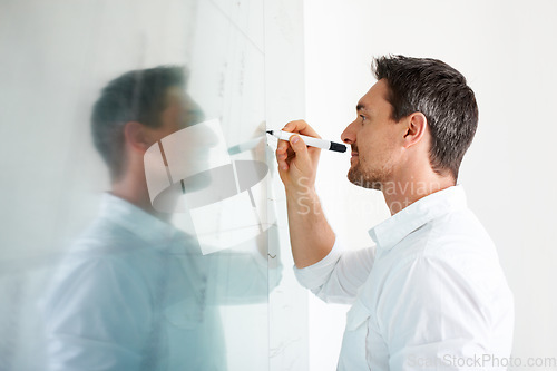 Image of Man, writing on glass board and brainstorming, business ideas at creative startup with agenda and planning. Productivity, schedule or timeline for SEO project, marketing strategy and moodboard
