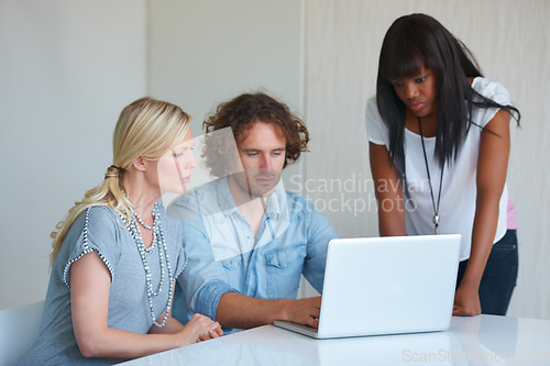 Image of Laptop, office group and team reading, collaboration and cooperation on online report, research or web design. Editing process, creativity and people teamwork, planning or check project development