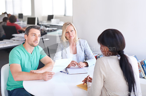 Image of Business people, job interview and paper for startup career and manager in meeting at tech company. Professional clients or employer with documents, resume or CV for information technology onboarding