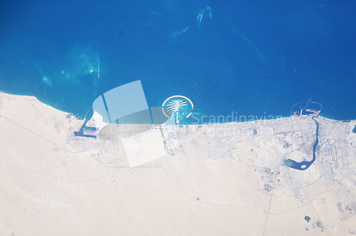 Image of Earth, satellite and landscape, map of desert and Dubai, water and sand in environment, nature and geography. Aerial view, country and terrain, ocean or sea from space with city, island or coastline