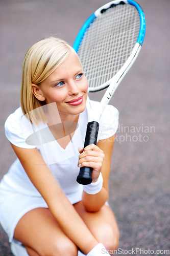 Image of Tennis, woman and thinking with racket outdoor for training, contest and performance in competition. Happy young athlete, sports player and kneeling to daydream with bat for tournament game on court