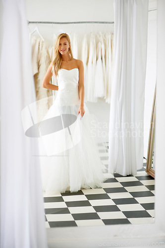 Image of Wedding, dress and portrait of young bride in a luxury boutique, shop or store in a mall. Retail, style and female person from Canada preparing for marriage ceremony, party or reception for love.