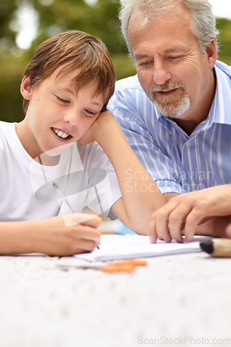 Image of Family, son and father with homework outdoor for helping, learning and development with happiness at home. Man, child and notebook, writing or reading with stationary in backyard of house with smile
