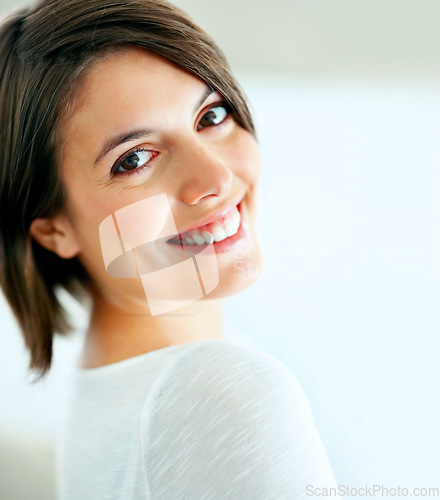 Image of Happy, relax and face or portrait of a woman in a house for comfort, positivity and confidence. Smile, young and a person or girl standing in a home with pride, mockup and beautiful in an apartment