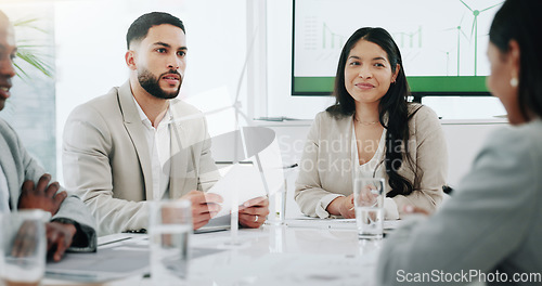 Image of Business people, renewable energy and windmill in team discussion or meeting for proposal or planning. Diversity, future or men and women talk technology development, collaboration and innovation