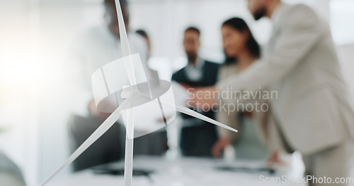 Image of Business people, meeting and wind turbine for eco friendly, sustainability and renewable energy planning in office. Windmill model, design and engineering team with documents in agriculture solution