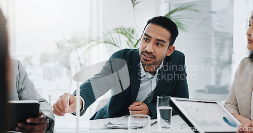 Image of Wind turbine, planning and man talking in office working on clean energy and sustainability electricity. Engineering, construction project and architect with eco friendly and biodiversity design