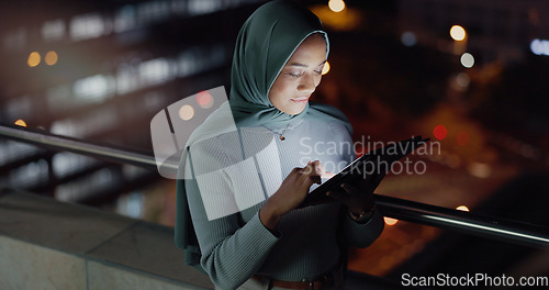 Image of Balcony, tablet and night woman reading social network feedback, customer experience or e commerce. Brand monitoring data, Islamic info and Muslim media worker typing online survey review