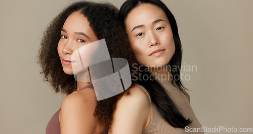 Image of Women, friends and face for skincare, beauty or cosmetics with diversity on a brown studio background. Young model or people in portrait together for skin care, dermatology health and natural makeup