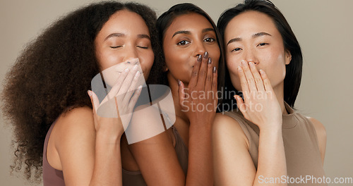 Image of Women, diversity and blow kiss with beauty, face and smile for wellness, dermatology and friends on studio background. Unique skin, natural cosmetics and inclusion with skincare, smile and antiaging