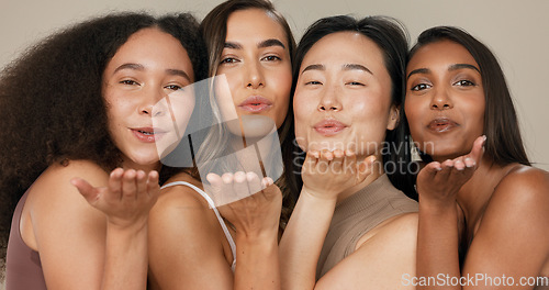 Image of Beauty, women or friends blow kiss in studio for diversity, inclusion and wellness. Face of happy people on neutral background for different facial care, dermatology glow or makeup and cosmetics