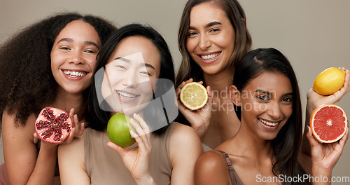 Image of Women, portrait and beauty, diversity and fruit with dermatology and friends on studio background. Unique skin, natural cosmetics and inclusion, eco friendly skincare, smile and citrus for vitamin c